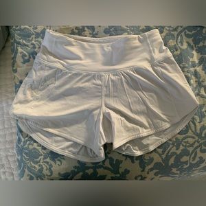 Size 2 2.5” white Lulu speed up shorts like new with nude liner
